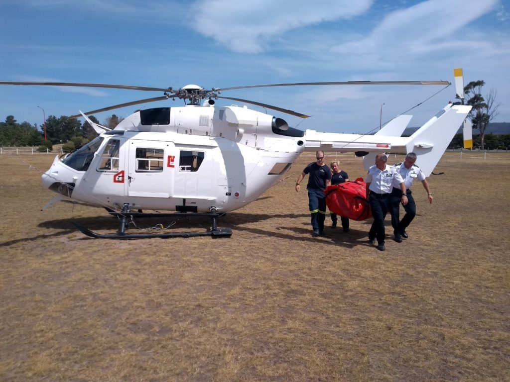 Ambulance Tasmania helicopter team carry